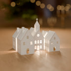 Vila de Natal com 4 Casinhas e Igrejinha para Vela LED decorando o ambiente